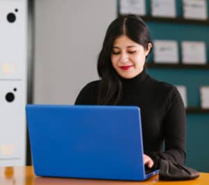 Latina working on laptop