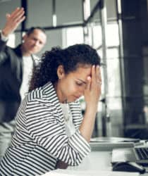 female executive being yelled at by male colleague