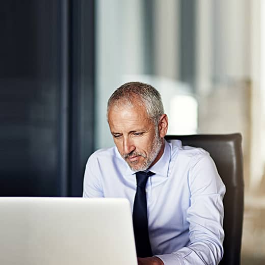 Man Looking at a Computer