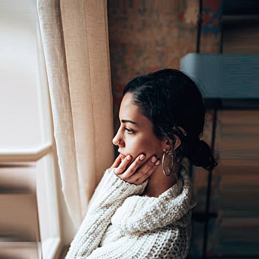 Woman Looking Out the Window